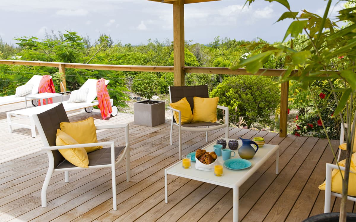 Breakfast on the terrace with croissants and tropical views